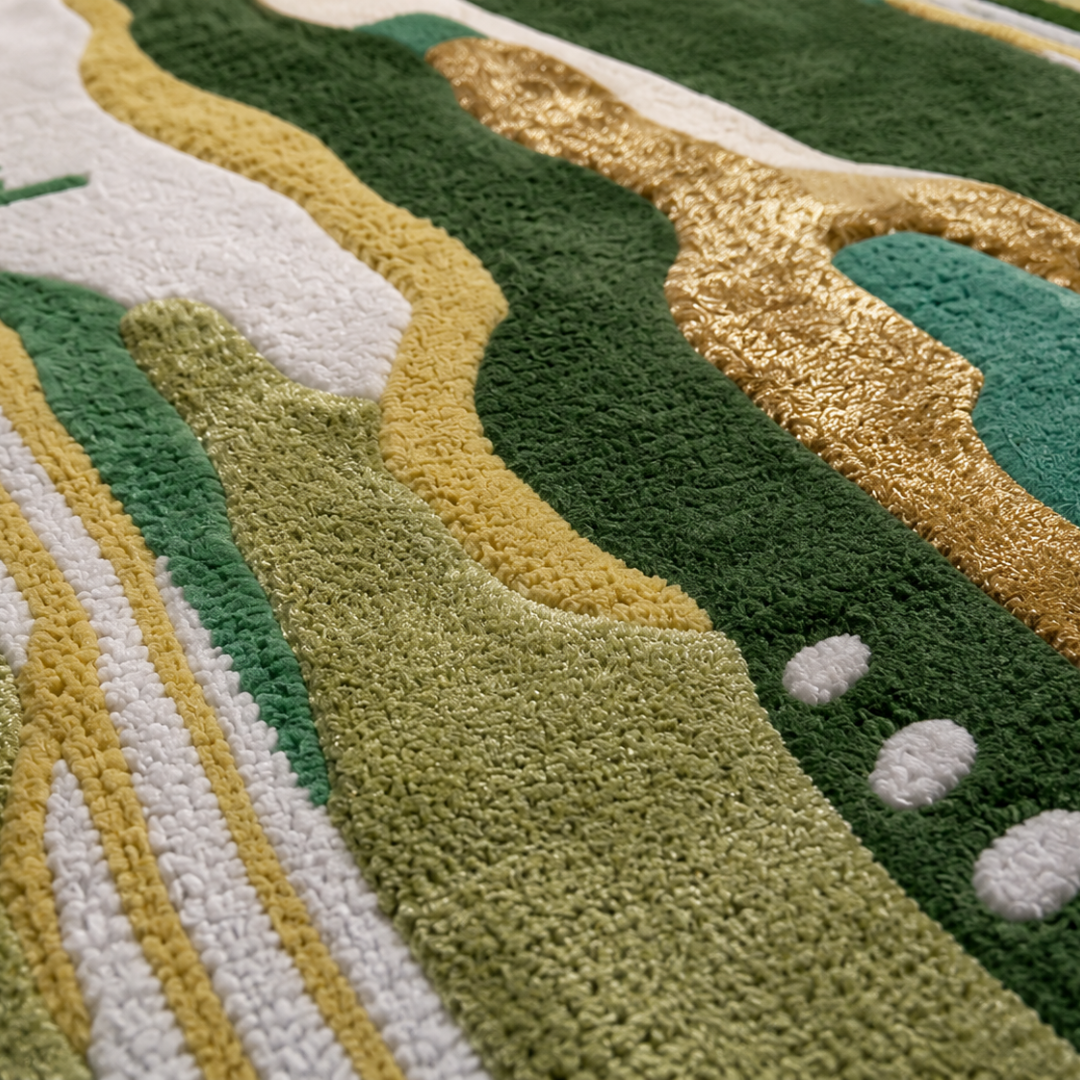 Close up texture of green and gold hand tufted abstract rug