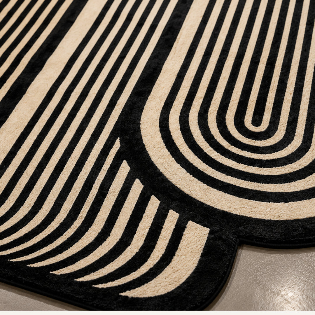 Close-up texture of monochrome linear hand tufted rug with sculpted detailing