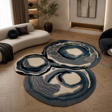 Modern sculptural abstract rug styled in a contemporary luxury living room
