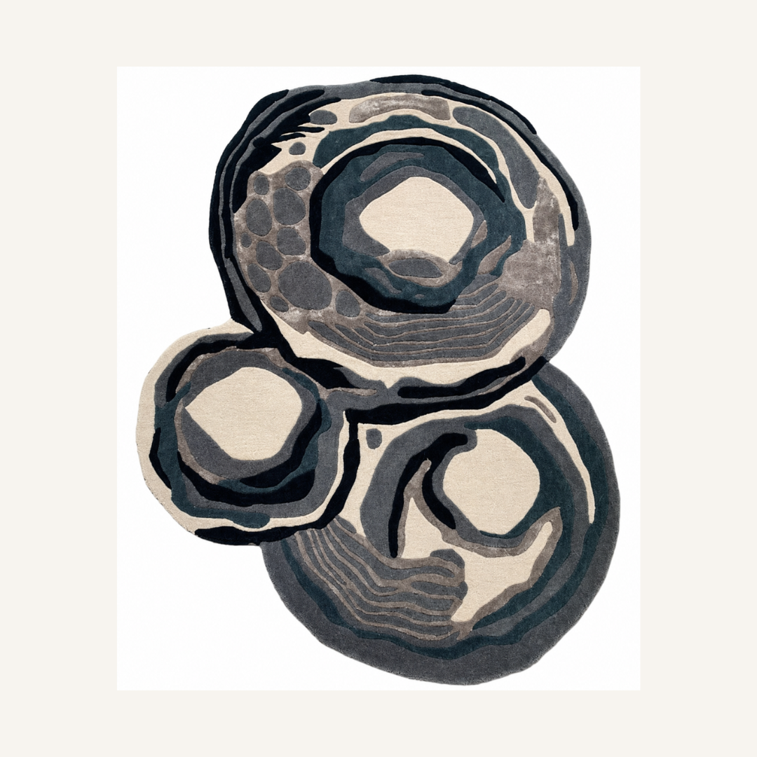 Organic abstract luxury rug with layered circular patterns isolated on white background
