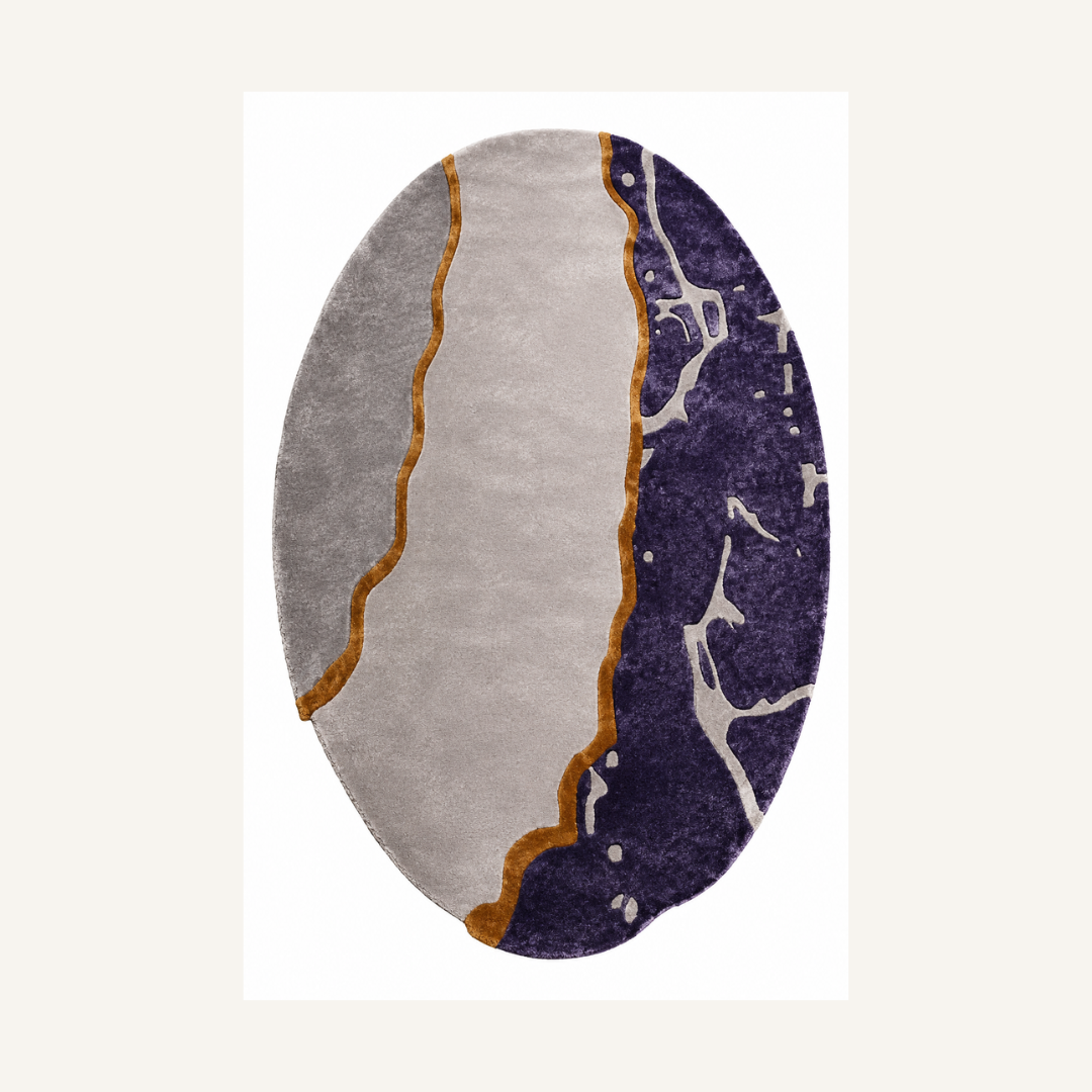 Luxury oval abstract marble rug styled in a modern designer living room
