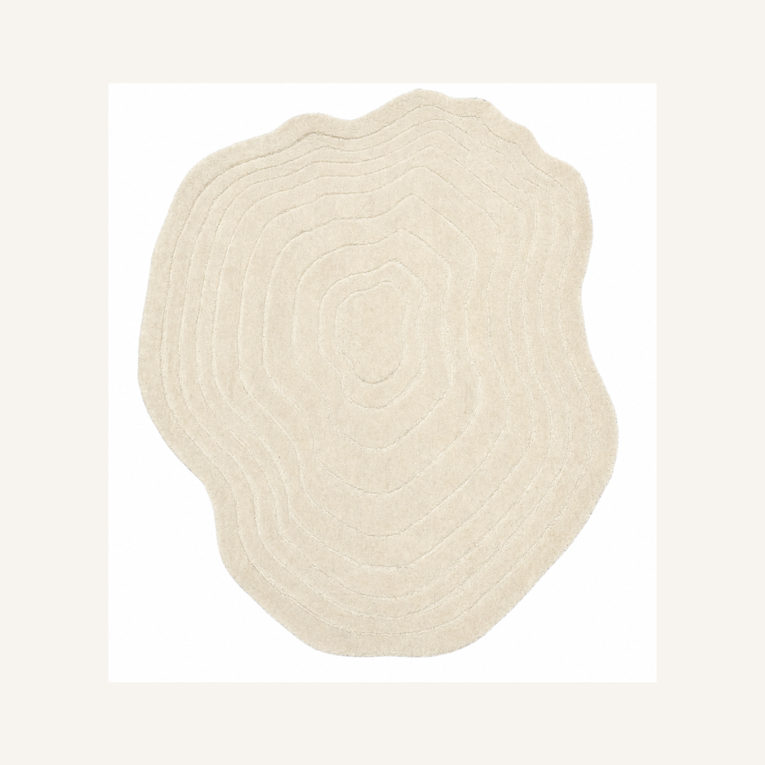 Green contour luxury hand tufted rug isolated on beige background
