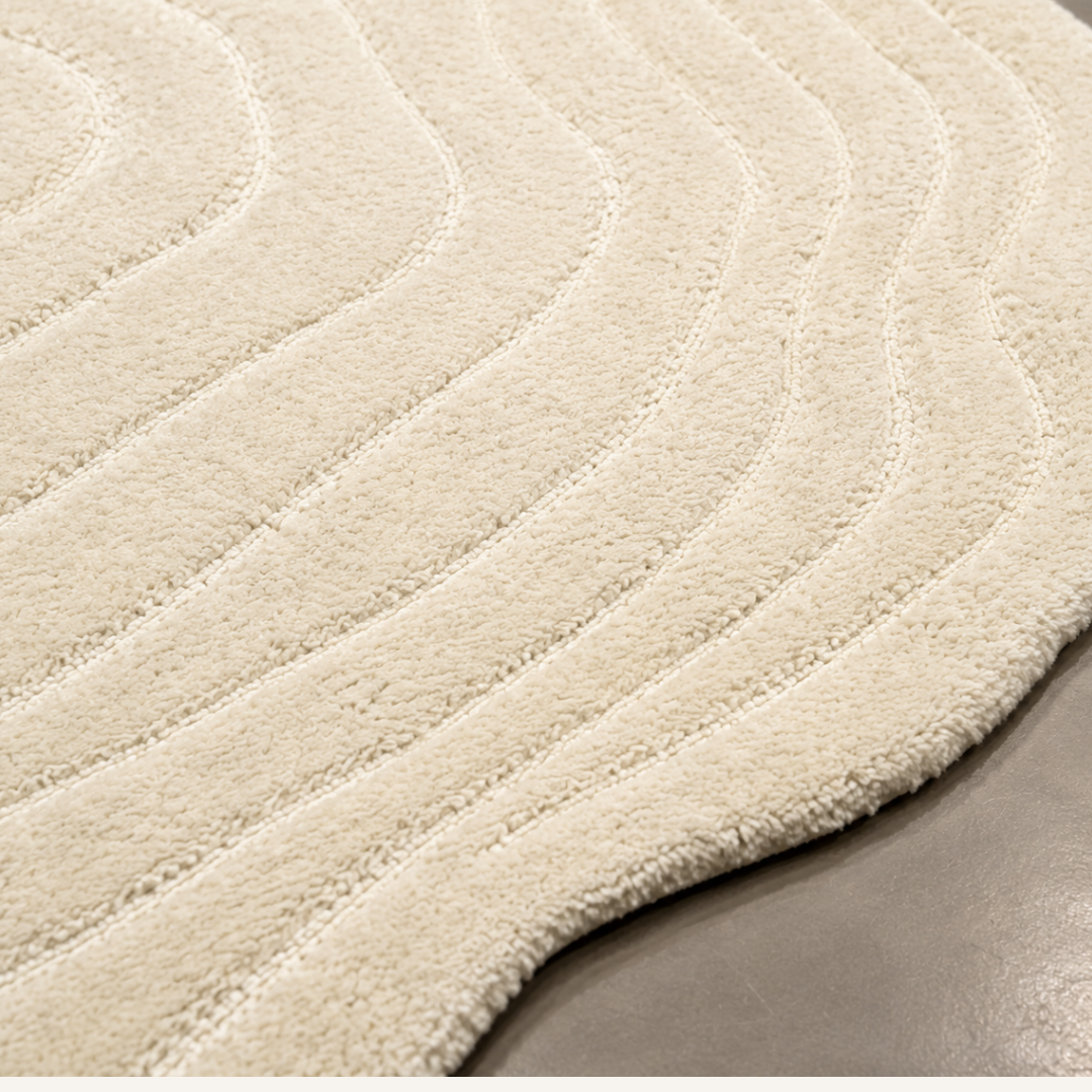 Close-up texture of green contour hand tufted rug with sculpted detailing