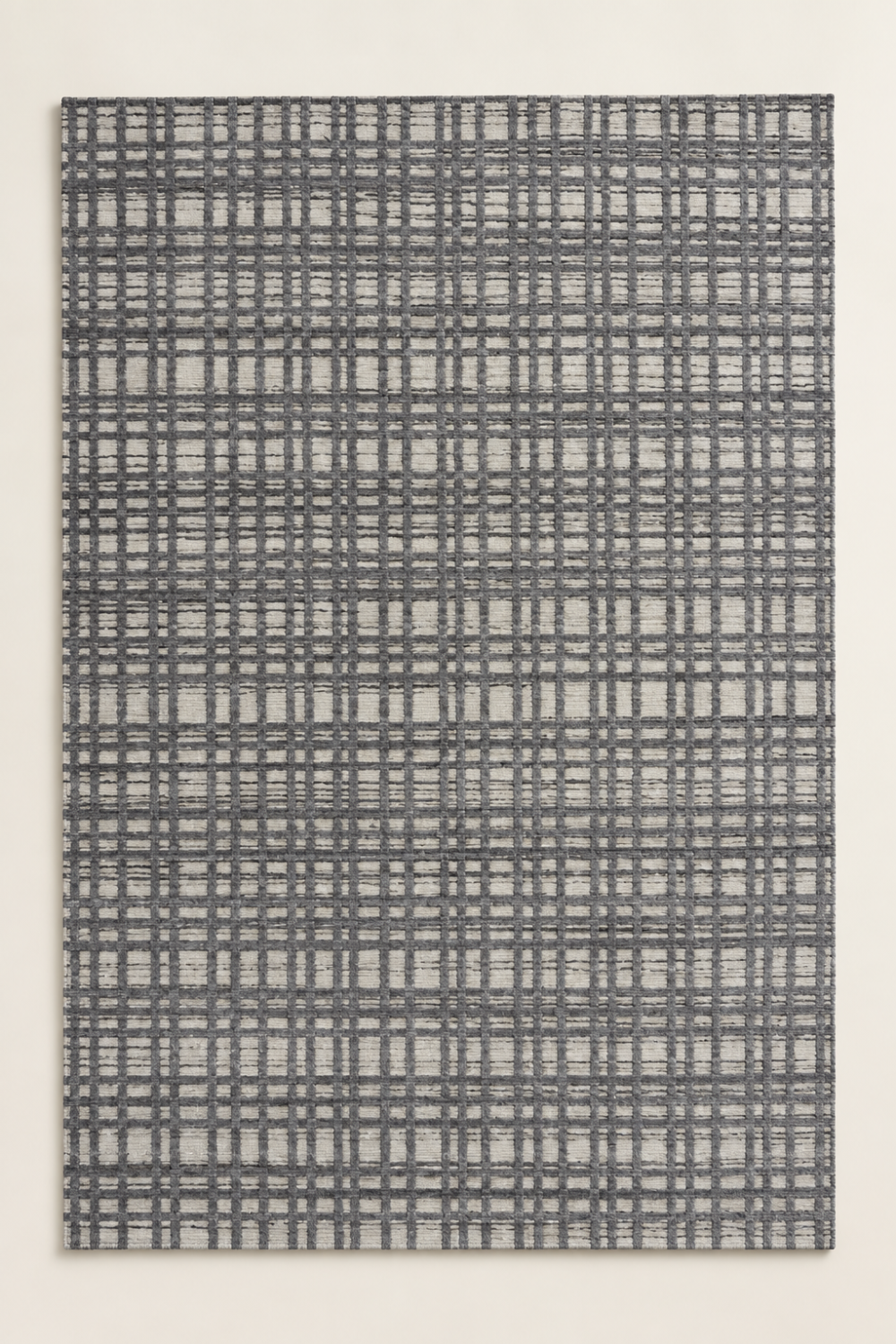 Ash Grid luxury handloom wool and viscose grey contemporary area rug styled in a modern architectural living room with neutral interiors