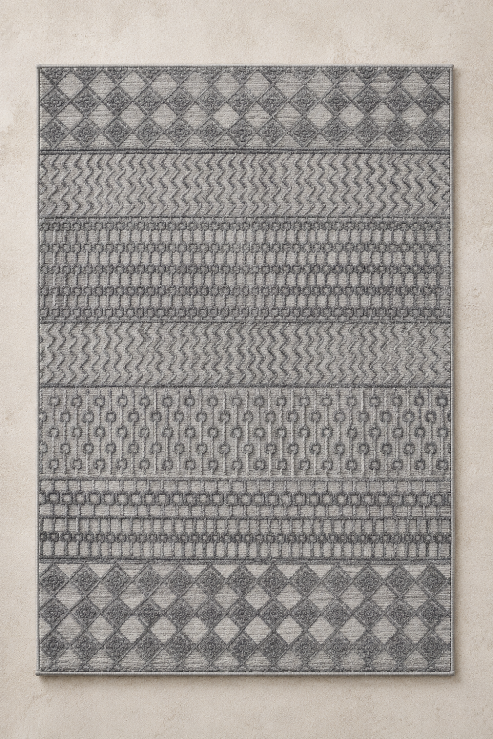 Atlas Rhythm handcrafted handloom over hand tufted grey New Zealand wool area rug featuring geometric diamond motifs, carved wave bands, and artisan textured detailing