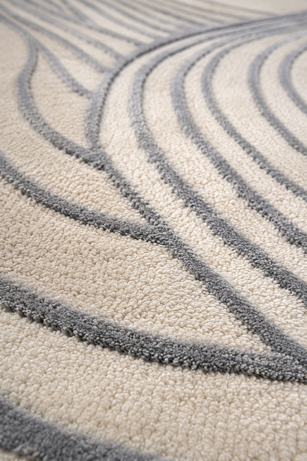 Close-up detail of Aurelia Wave rug highlighting raised carved contours, plush pile texture and handcrafted luxury construction.