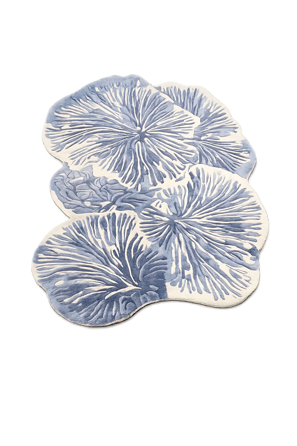 Luxury Azure Bloom Organic Rug styled in a bright coastal-modern living room overlooking the sea with designer furniture and natural light.