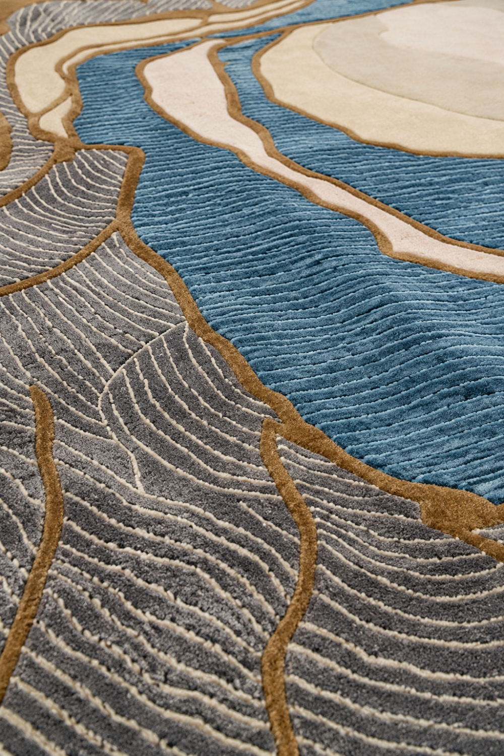 Close-up detail of Azure Canyon rug highlighting hand-carved contour lines, premium pile texture and artisan craftsmanship.