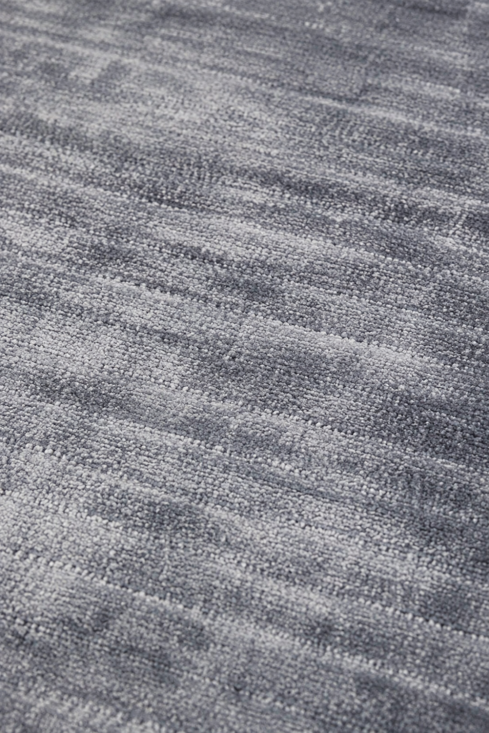 Close-up of the Azure Mist Handloom Plain Viscose rug highlighting the handcrafted weave, soft powder blue fibres and refined tonal texture.