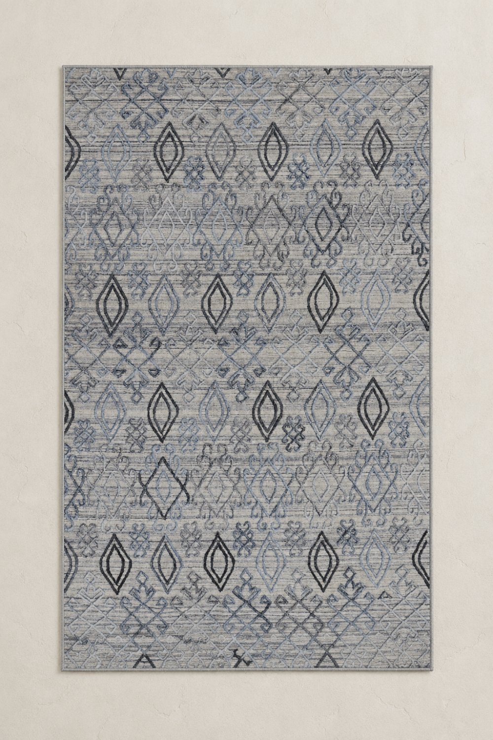 Azure Nomad handcrafted handloom over hand tufted blue grey New Zealand wool area rug featuring carved diamond motifs and artisan detailing