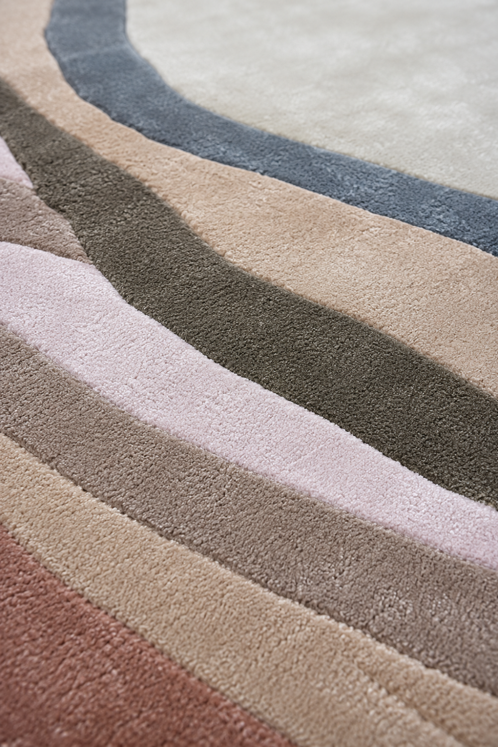 Close-up texture detail of Blush Contour luxury rug showing plush pile, layered contour design and premium handcrafted finish.