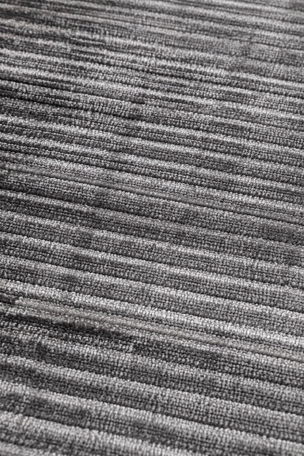 Close-up of the Charcoal Horizon Handloom Self Design rug highlighting the handcrafted horizontal weave and premium viscose tencel bamboo fibres.
