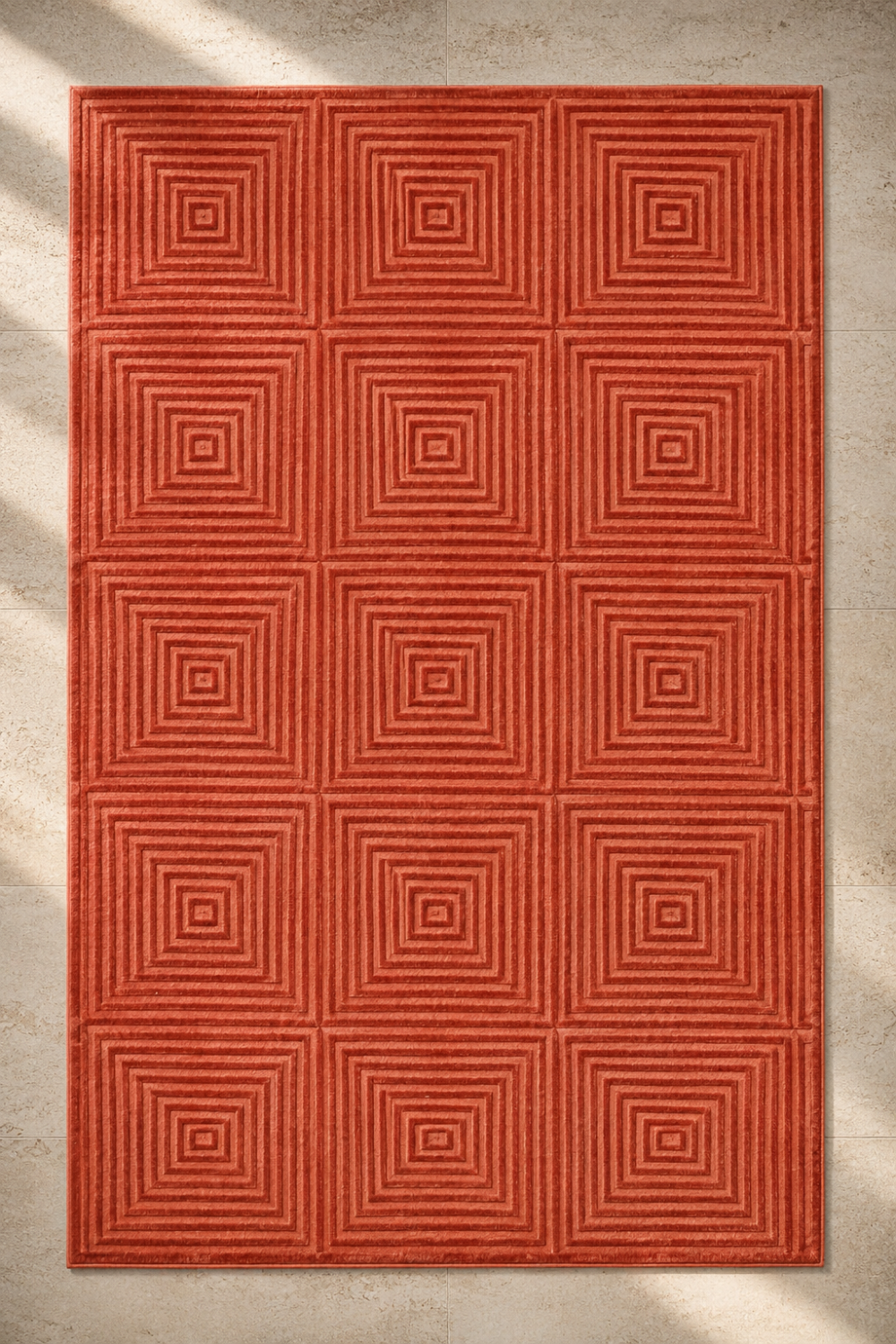 Concentric Grid Rug handcrafted in Handloom Viscose Tencel Bamboo with an embossed concentric square self-design in terracotta red.