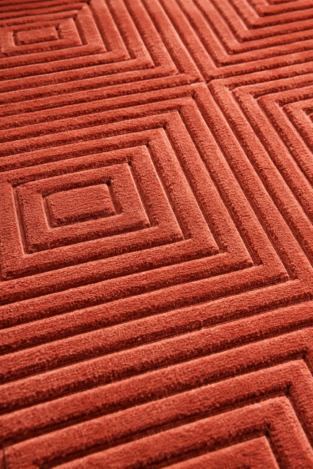 Close-up of the Concentric Grid Rug highlighting the raised concentric square texture and premium Handloom Viscose Tencel Bamboo craftsmanship.