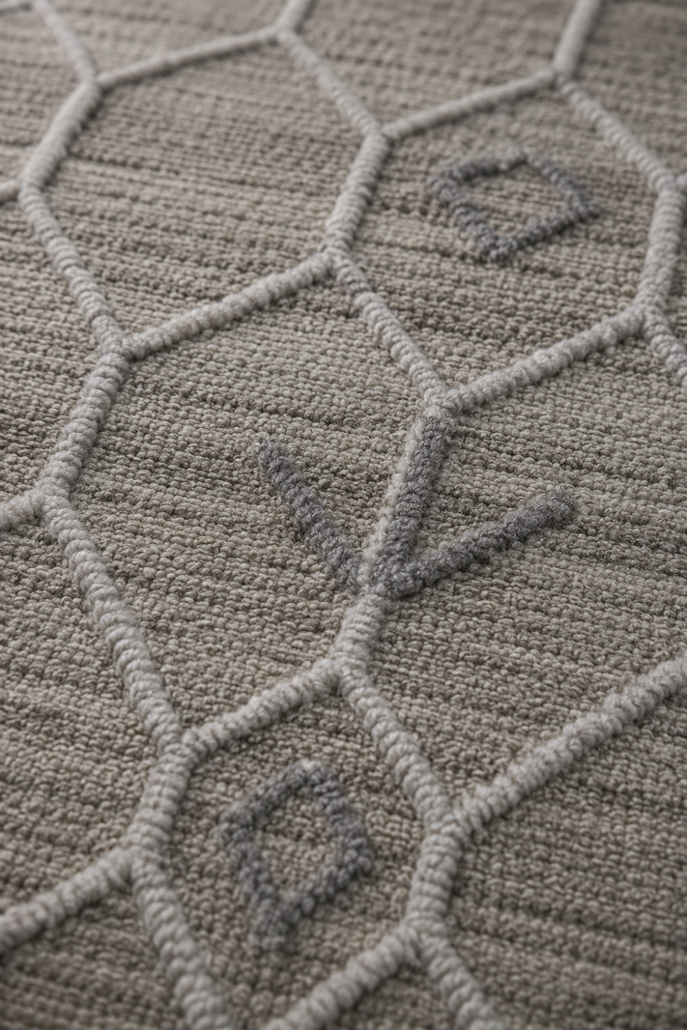 Close-up of the Desert Lattice handloom New Zealand Wool rug highlighting carved geometric lattice texture and artisan craftsmanship