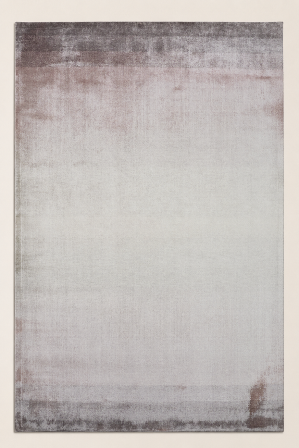 Desert Mist luxury handloom Tencel taupe ombre area rug styled in a contemporary minimalist living room with soft neutral interiors