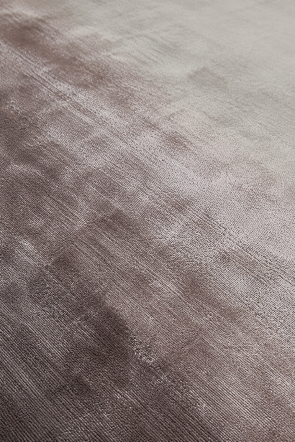 Close-up of the Desert Mist handloom Tencel rug showcasing its taupe ombre gradient, silky texture and handcrafted finish