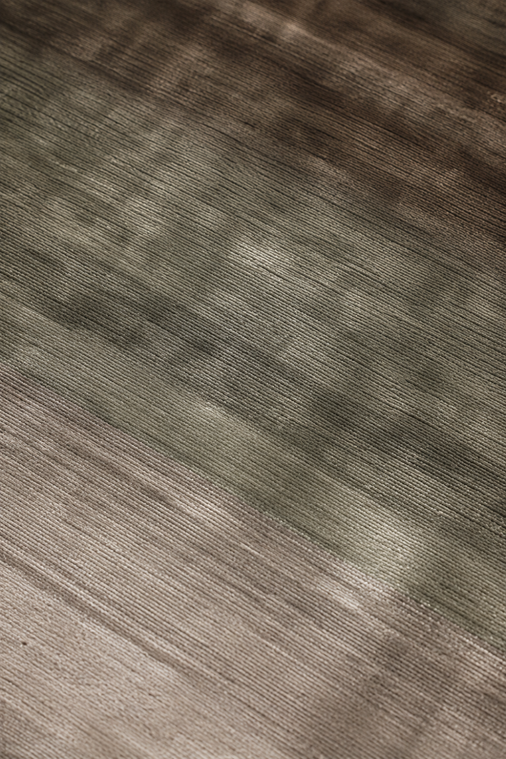 Close-up of the Forest Mist handloom Tencel rug showcasing its silky texture, earthy gradient tones and handcrafted finish