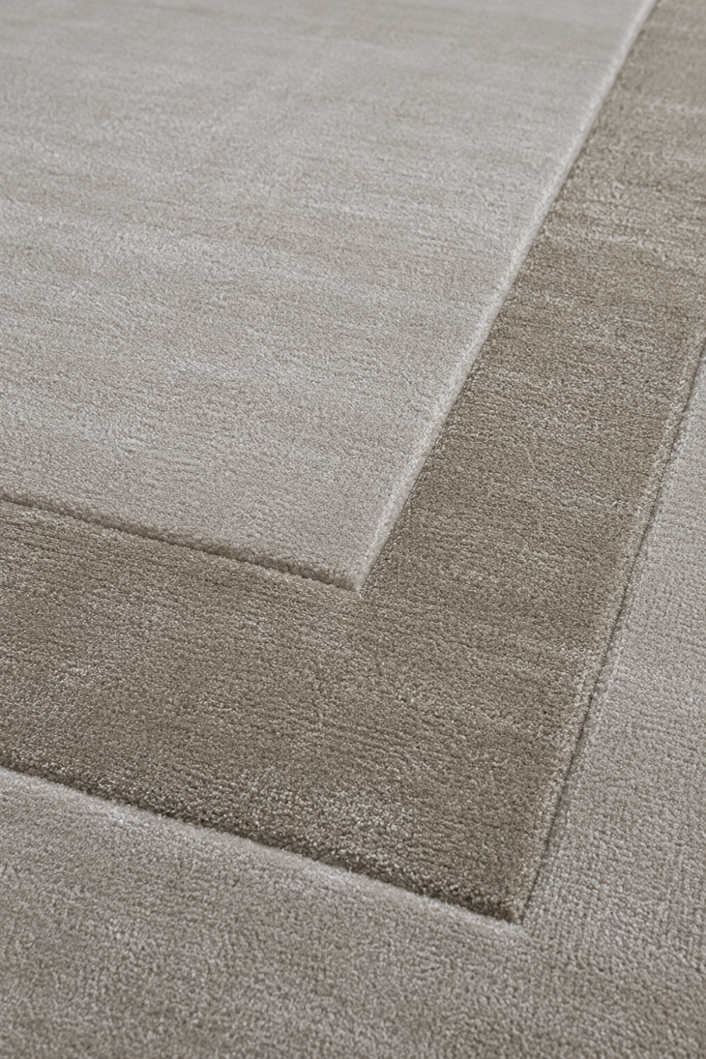 Close-up of the Framed Border Minimalist Rug showcasing premium Handloom Viscose Tencel Bamboo texture and sculpted border detailing.