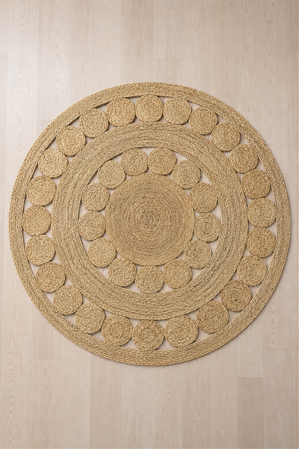 Halo Weave Round Rug featuring handcrafted concentric woven circles in a natural textured finish.