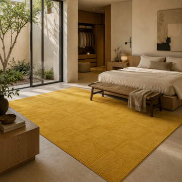 Yellow handloom rug and carpet styled in a warm modern bedroom interior
