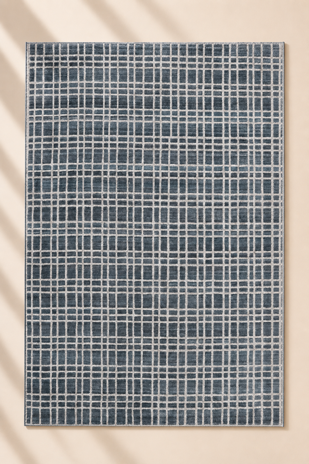 Harbor Grid luxury handloom wool and viscose blue contemporary area rug styled in a modern glass house living room with luxury interiors
