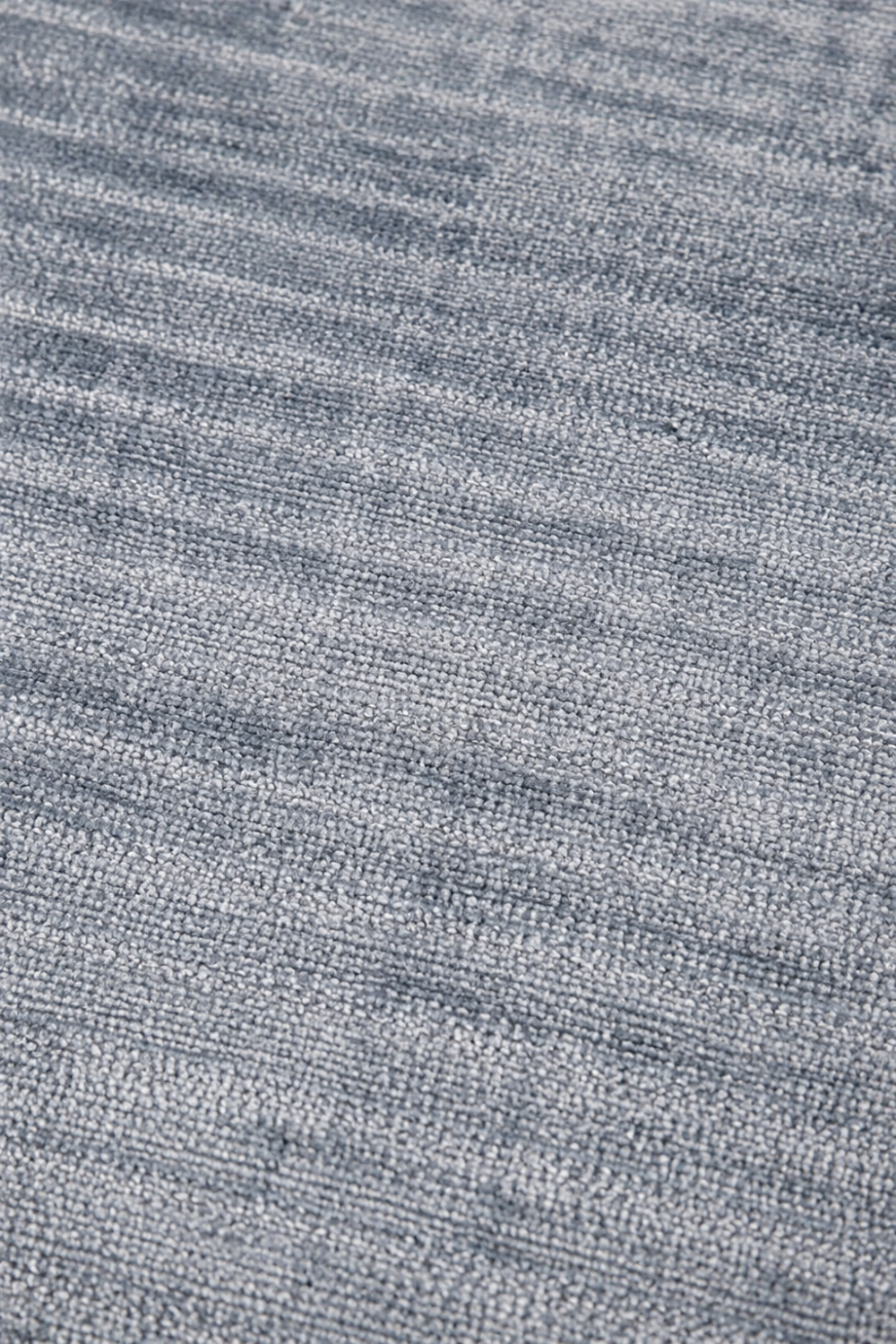 Close-up texture of the Harbor Sky Handloom Plain Viscose rug showcasing its handcrafted weave, fine linear texture, and luxurious silk-like finish.