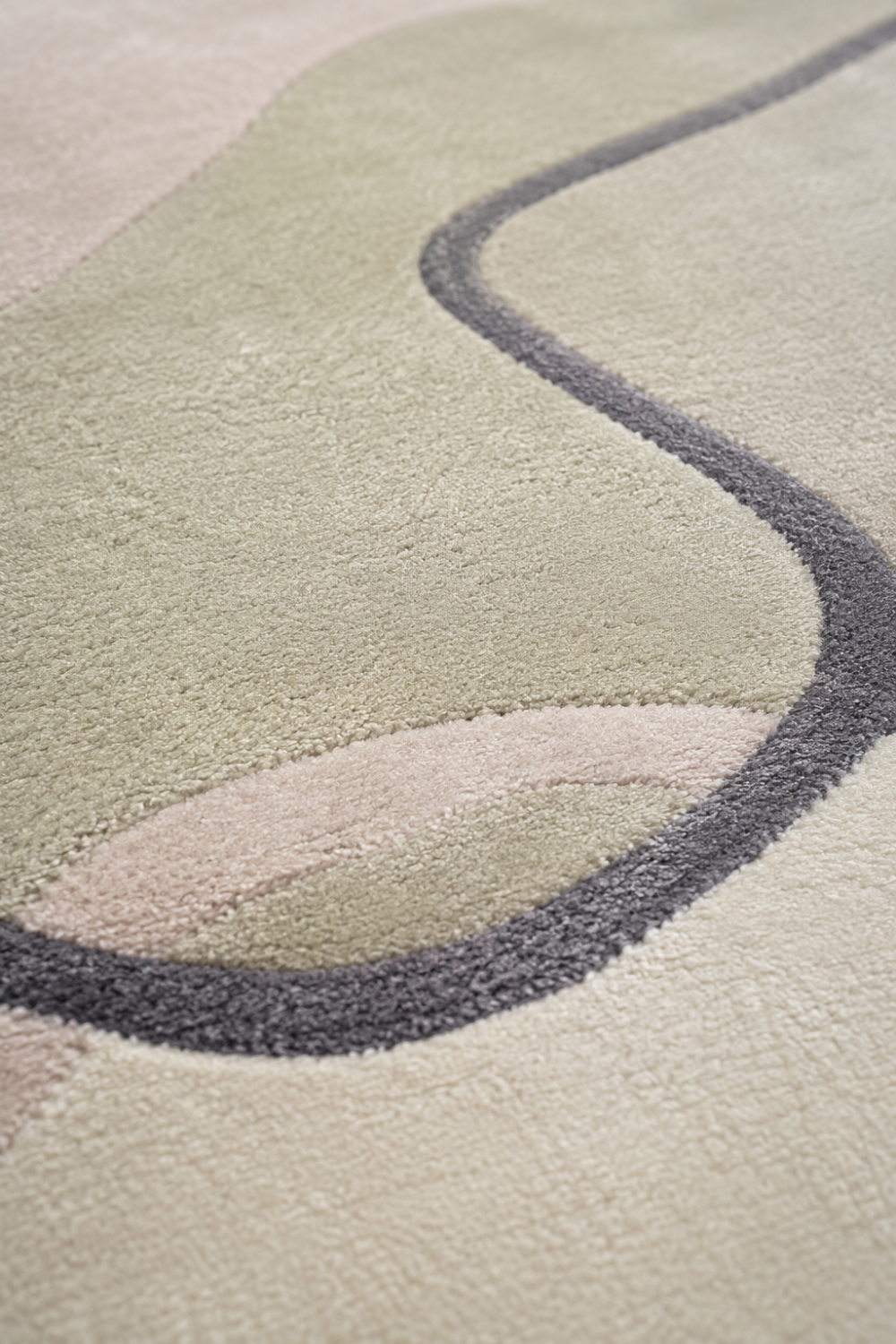 Close-up texture detail of Ivory Bloom abstract rug showcasing premium craftsmanship, soft pile texture and elegant organic design.