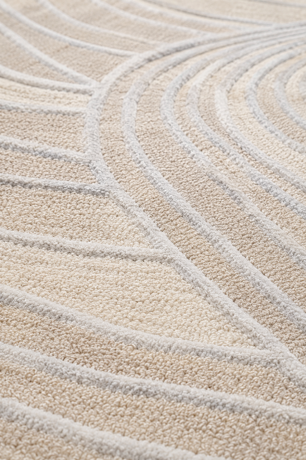 Close-up detail of Ivory Crest rug highlighting raised carved contours, premium loop pile texture and handcrafted craftsmanship.