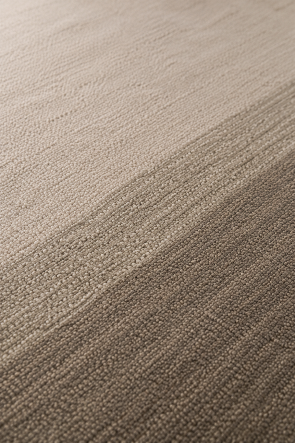 Close-up of the Linen Horizon handloom New Zealand wool rug showcasing handcrafted texture, soft tonal shading and elegant multi-tone colour transitions