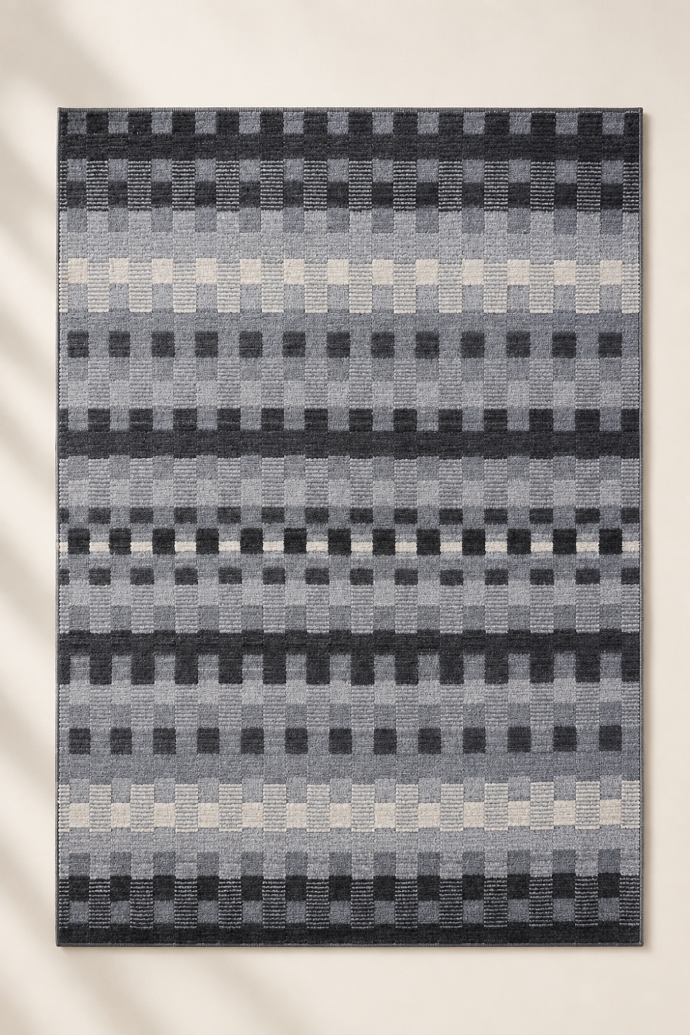 Metro Mosaic handloom New Zealand wool and viscose box rug featuring a contemporary geometric pixel block pattern in charcoal and grey tones
