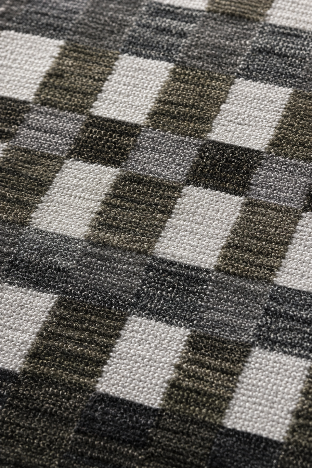 Close-up of the Metropolitan Grid handloom wool and viscose rug highlighting handcrafted boxed texture premium weave and architectural detailing