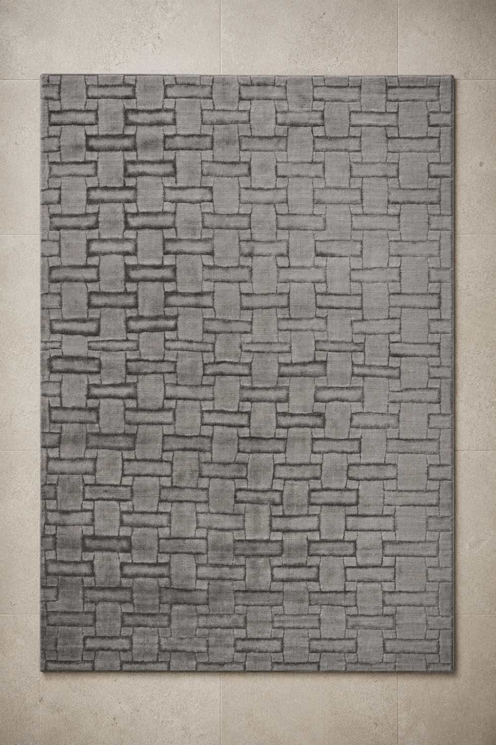 Metropolitan Weave Rug in Handloom Viscose Tencel Bamboo styled in a luxury contemporary living room featuring a carved basket-weave geometric pattern in elegant grey tones.