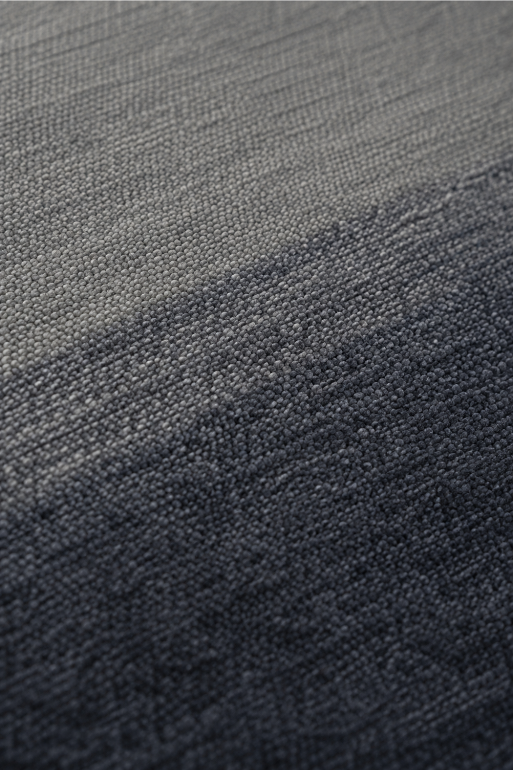 Close-up of the Midnight Tide handloom New Zealand wool rug showcasing handcrafted texture and grey to navy tonal transition
