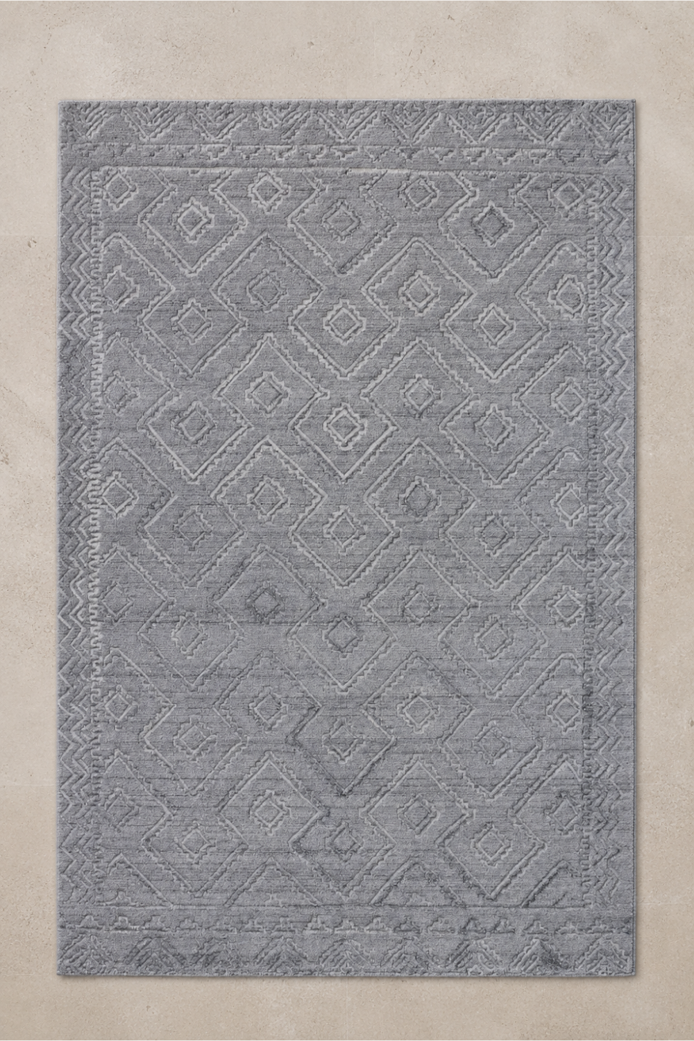 Mist Haven handcrafted handloom over hand tufted mist grey New Zealand wool area rug featuring carved diamond geometric patterns