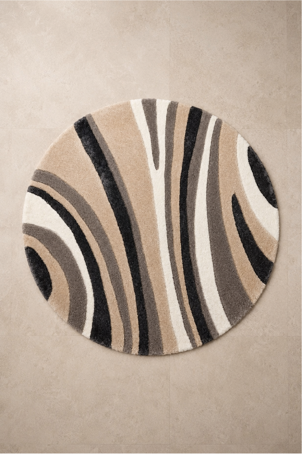 Monochrome Flow Round Hand Tufted Rug featuring sculpted abstract waves in ivory, beige, taupe, charcoal and black.