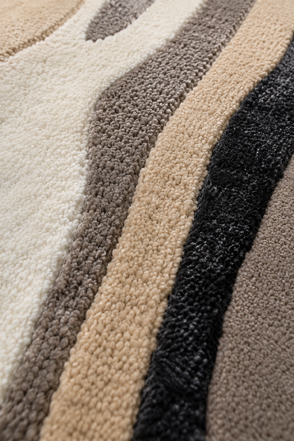 Close-up of the Monochrome Flow Round Hand Tufted Rug highlighting plush carved pile and premium handcrafted texture.