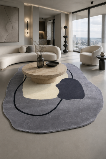 Luxury Moonstone Abstract Organic Rug styled in a contemporary designer living room with sculptural furniture and modern decor.