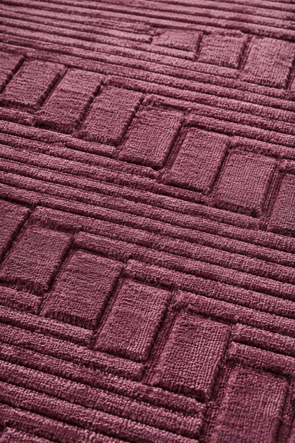 Close-up of the Mulberry Matrix Rug showing raised linear detailing, embossed block texture, and luxurious Handloom Viscose Tencel Bamboo craftsmanship.