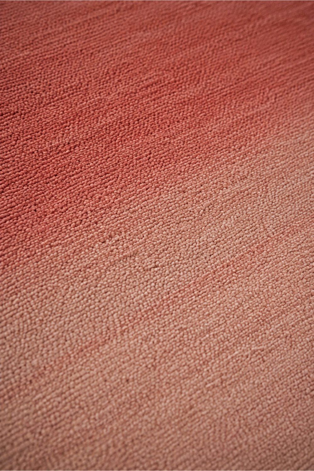 Close-up of the Rose Dusk handloom New Zealand wool rug showcasing handcrafted wool texture and soft pink gradient weave