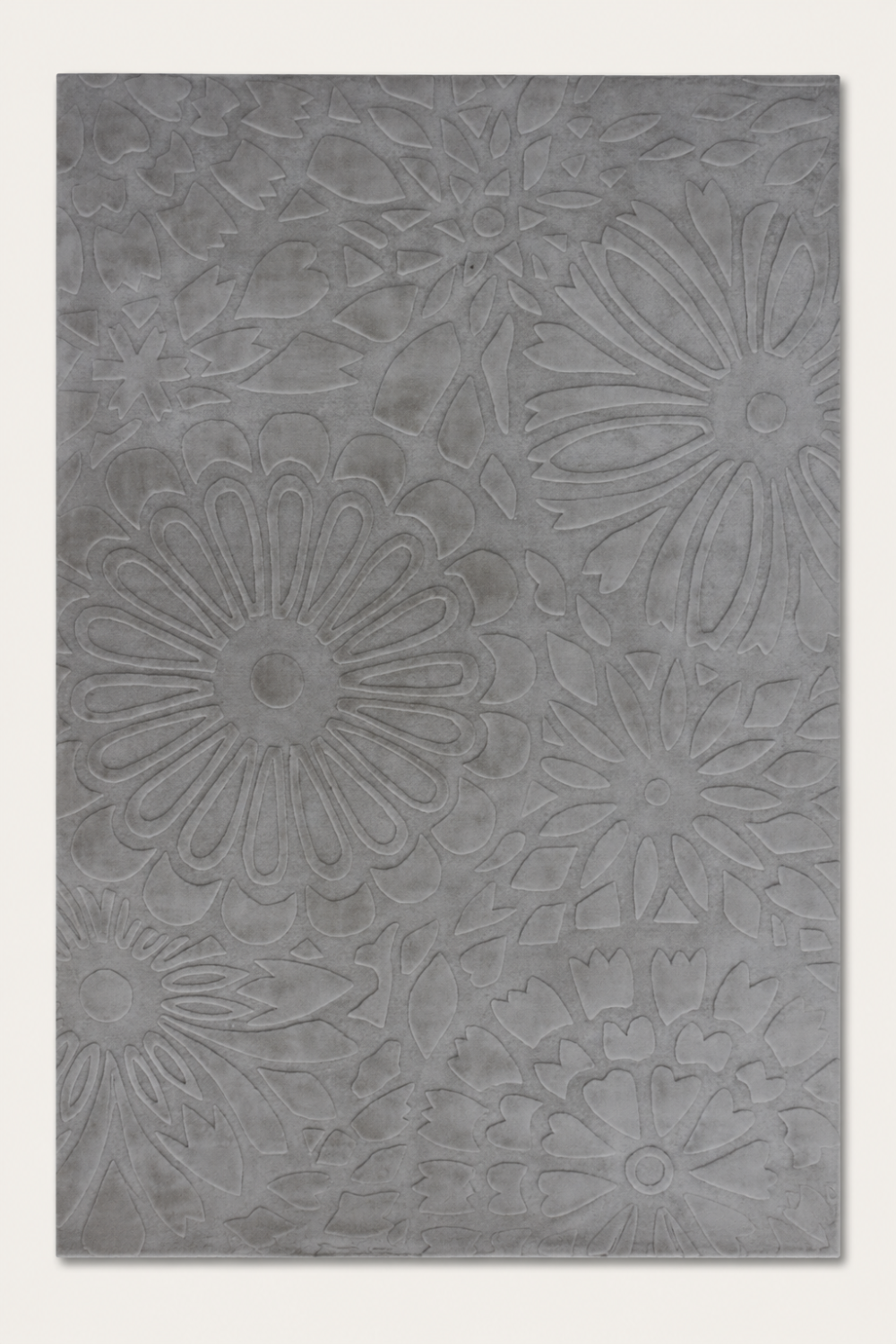 Silver Blossom Rug handcrafted in Handloom Viscose Tencel Bamboo with an all-over raised floral self-design in a soft silver-grey colour.