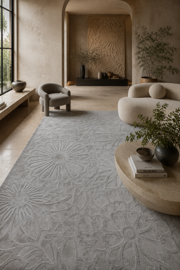 Silver Blossom Rug in Handloom Viscose Tencel Bamboo displayed in a contemporary luxury living room featuring an embossed floral self-design and handcrafted finish.