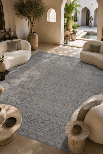 Silver Haven luxury handloom over hand tufted New Zealand wool grey geometric area rug styled in a contemporary Mediterranean inspired living room