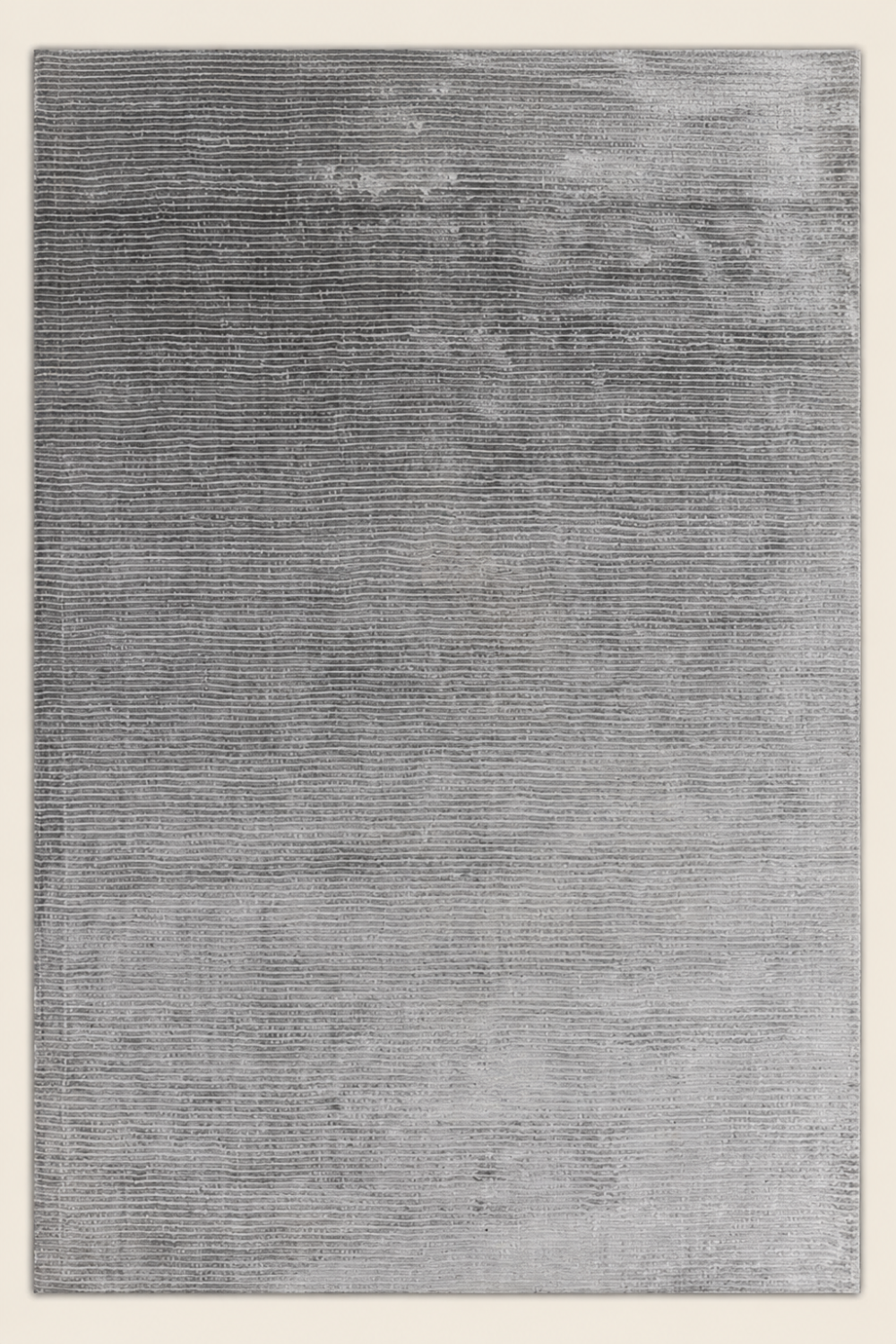 Silver Strata Handloom Plain Viscose rug styled in a contemporary luxury living room with soft silver grey textured design.