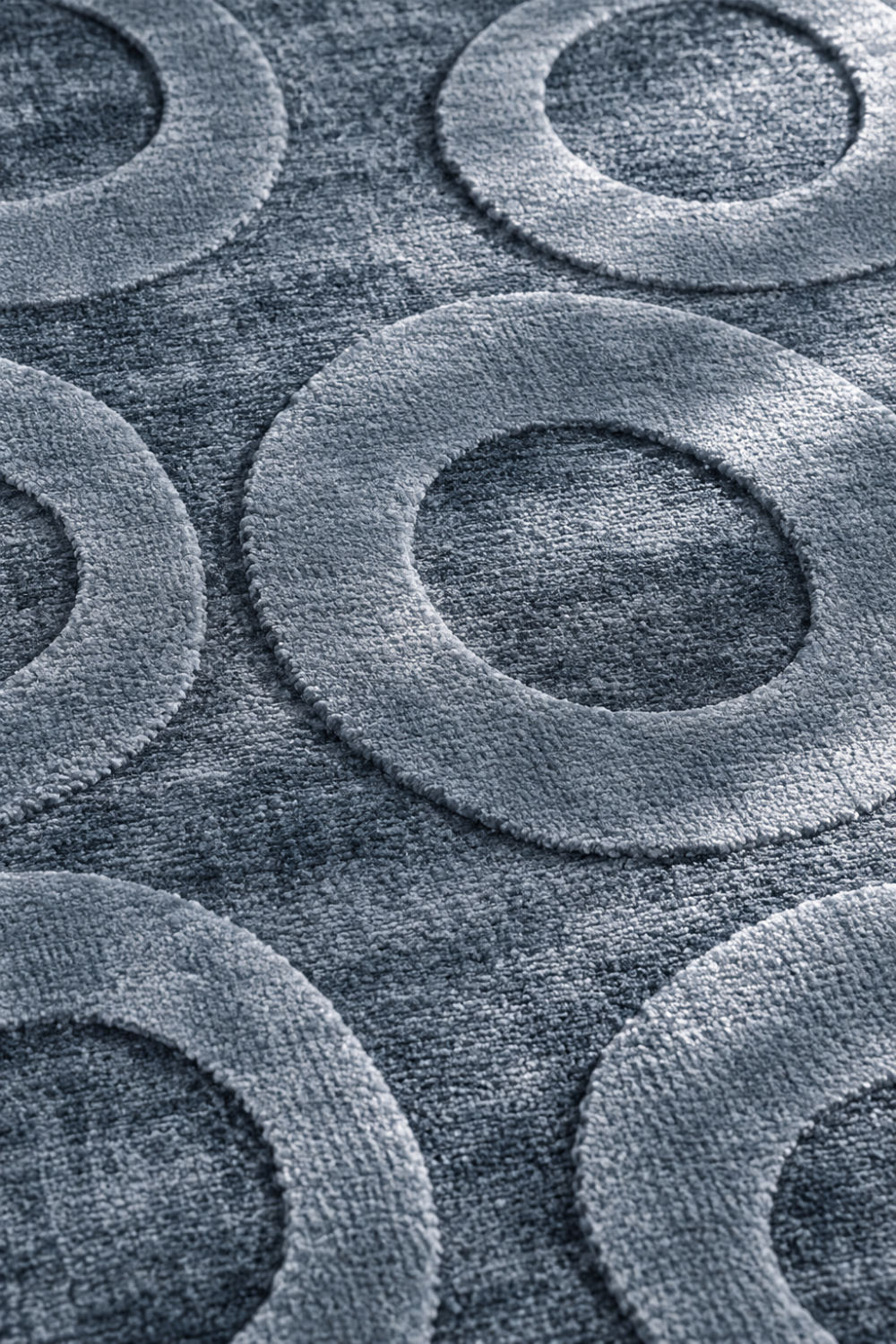 Close-up of the Slate Halo Circle Rug highlighting the raised circular halo texture and premium Handloom Viscose Tencel Bamboo craftsmanship.