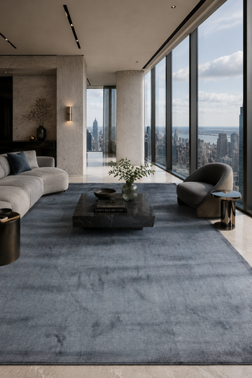 Slate Haven Handloom Plain Viscose rug styled in a luxury contemporary living room with elegant slate blue-grey handcrafted finish.