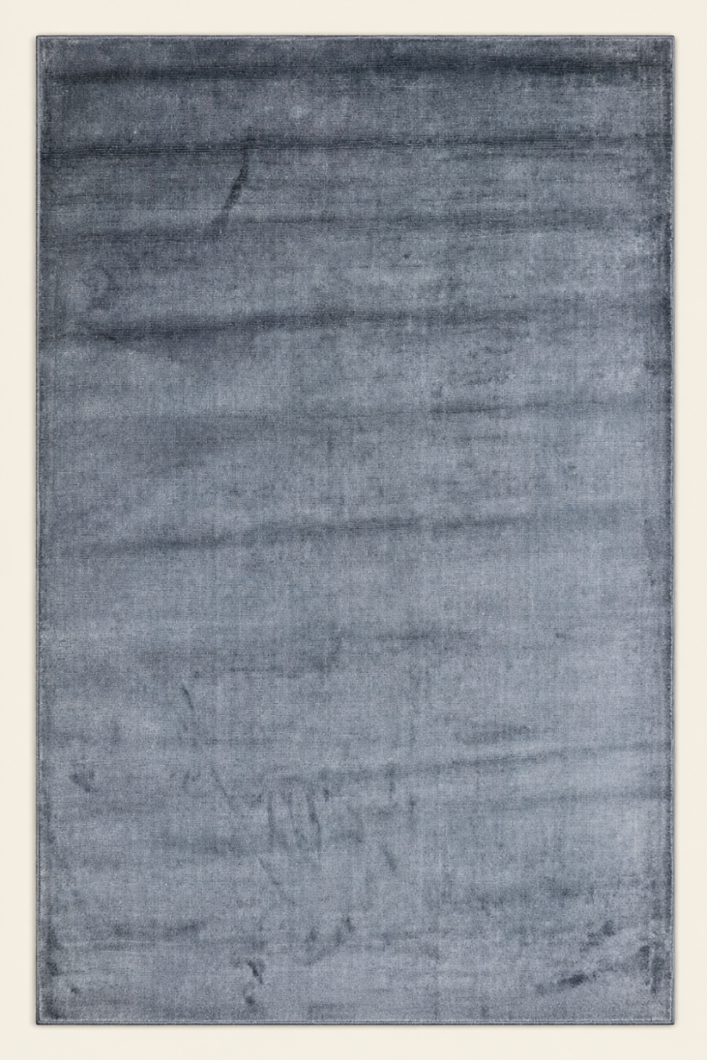 Slate Haven Handloom Plain Viscose rug styled in a luxury contemporary living room with elegant slate blue-grey handcrafted finish.