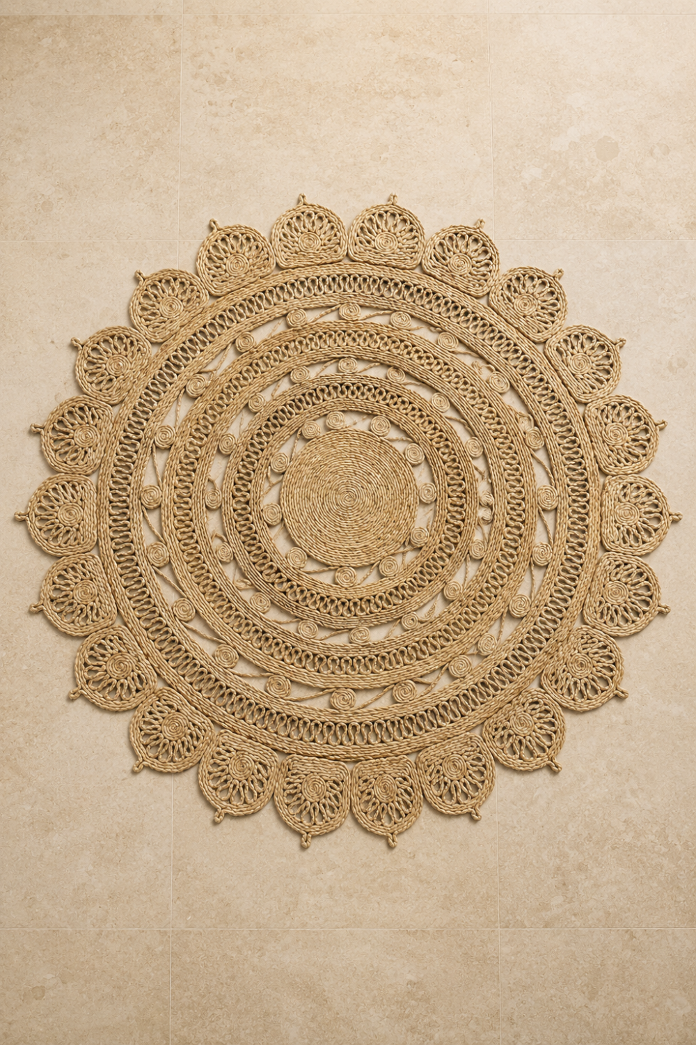 Solstice Jute Rug featuring handcrafted braided concentric patterns with an elegant scalloped border in natural jute.
