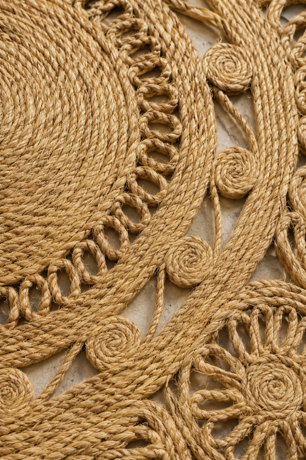 Close-up texture of the Solstice Jute Rug highlighting handcrafted braided jute detailing and intricate woven craftsmanship.