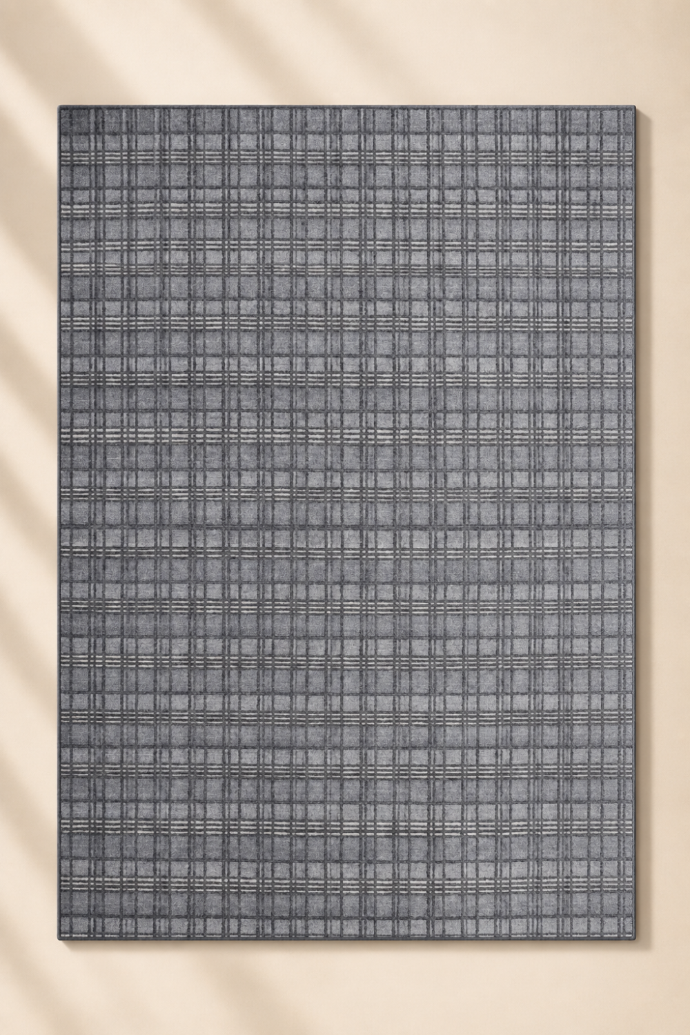 Sterling Grid handloom New Zealand wool and viscose contemporary area rug featuring a fine plaid grid pattern in charcoal grey and silver